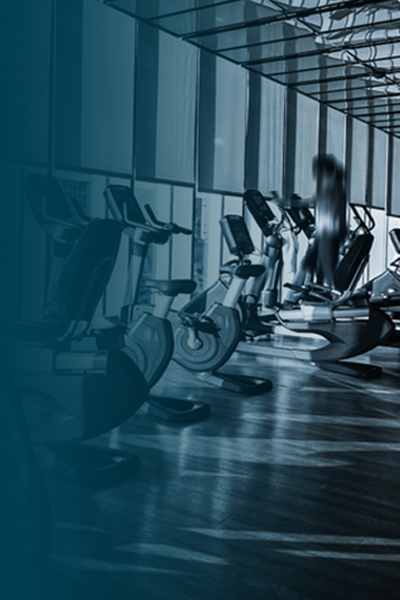 Fitness center interior showing stationary equipment