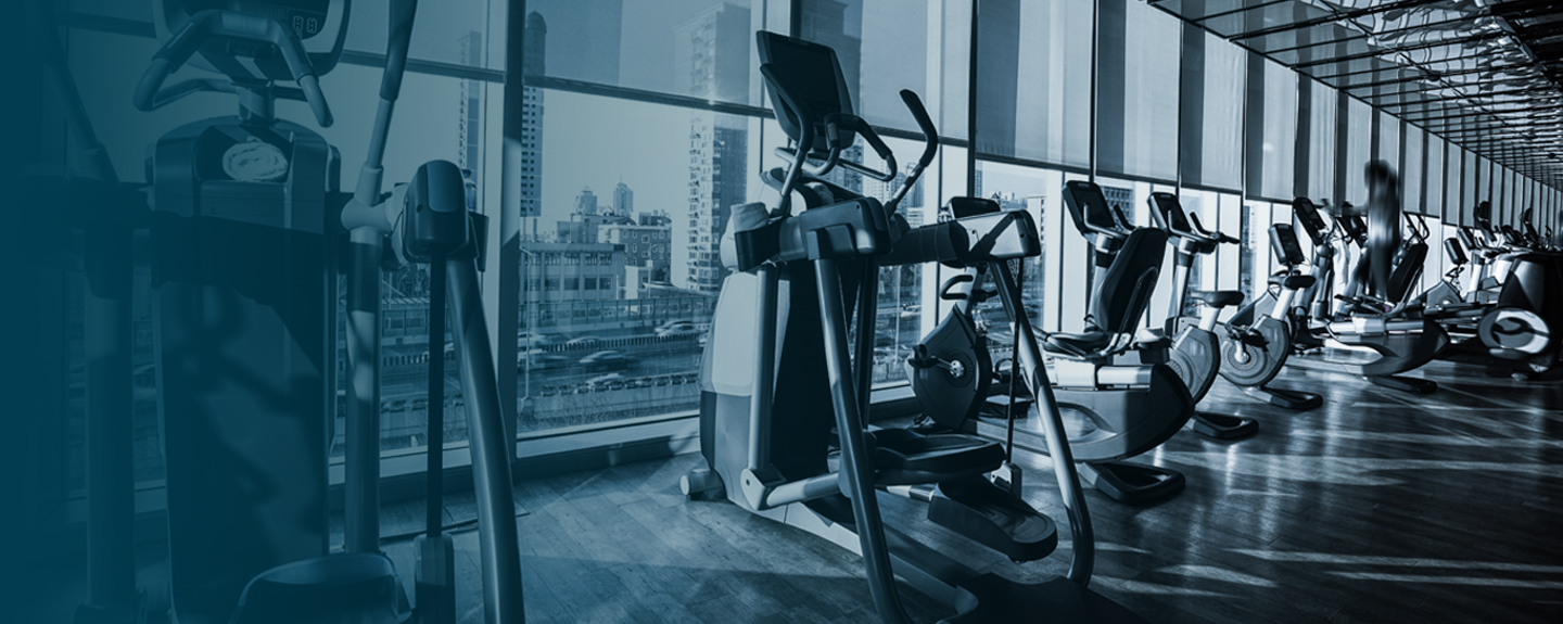 Fitness center interior showing stationary equipment