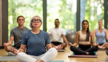 group of people in yoga class
